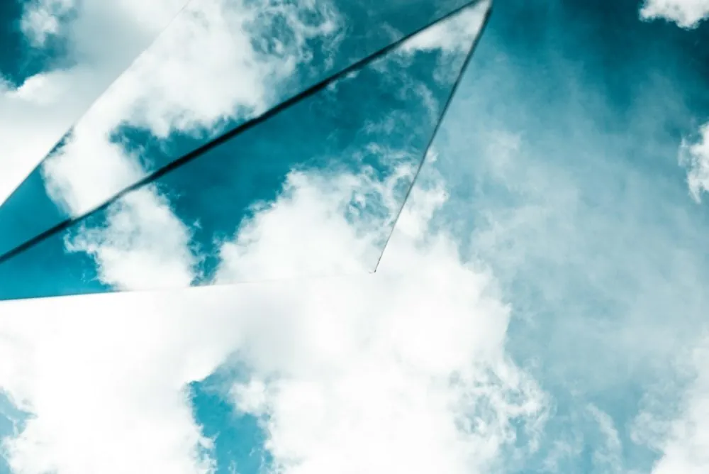 Clouds reflected in angled mirrors